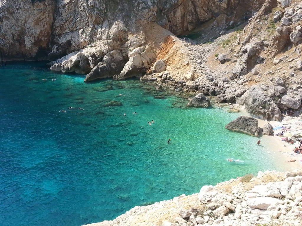 Hidden rocky cove with turquoise sea