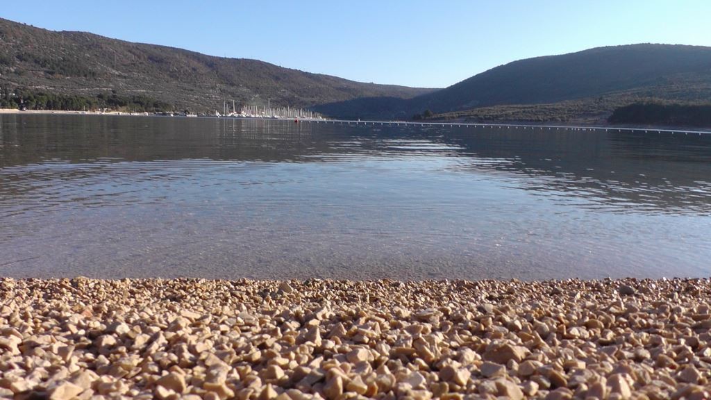 Pebble beach in a calm Cres bay