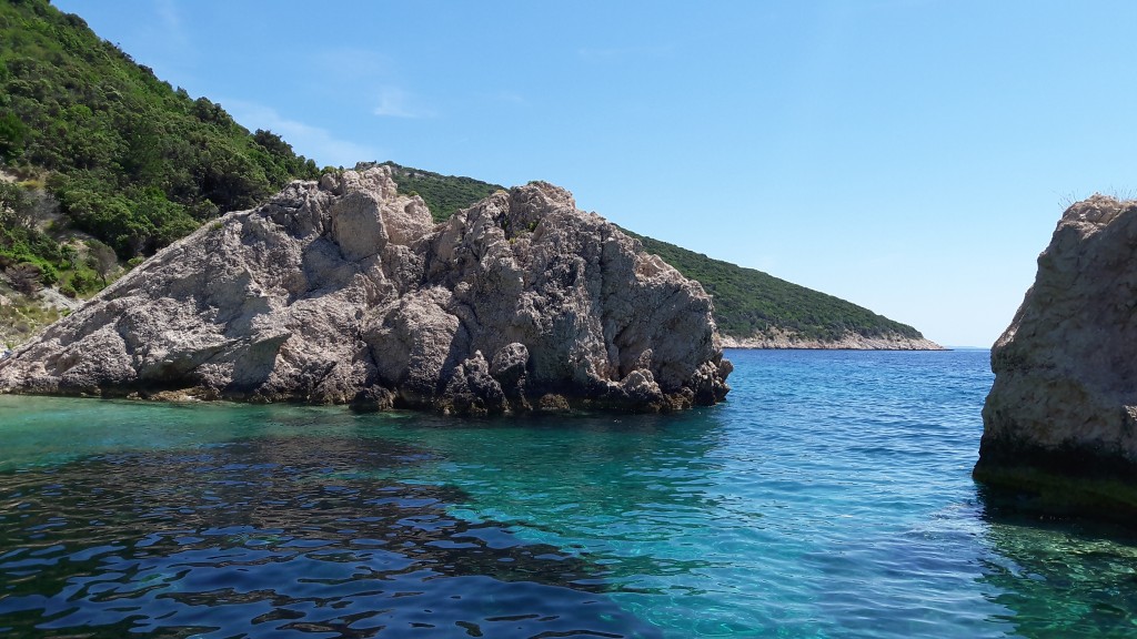 Rocky beach and clear Adriatic water